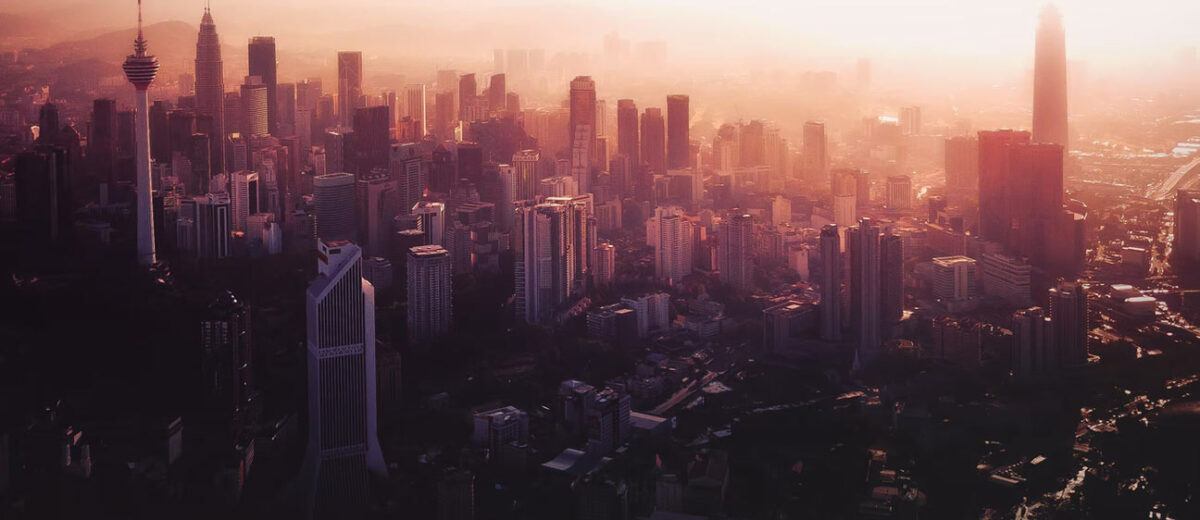 how to be more resilient - Kuala Lumpur city skyline at dawn.