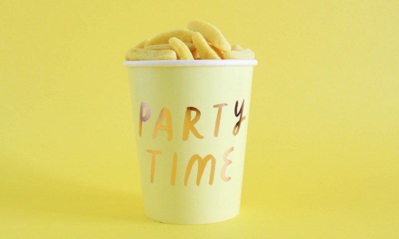 a bucket of fried snacks with the word "party time" on it (in yellow background)
