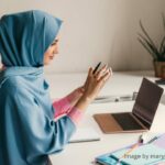office desks - a muslim woman hijab working in the office room