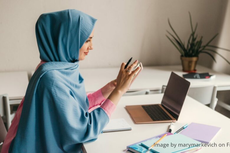 office desks - a muslim woman hijab working in the office room