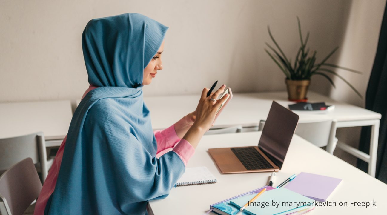 modern office desk - muslim woman hijab working in the office room
